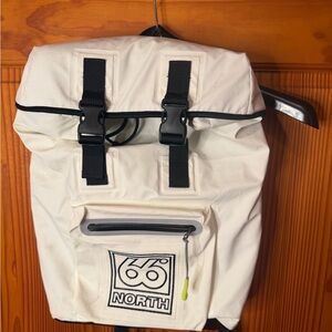 66 North Iceland Cream faux leather Backpack w zippered front pocket.